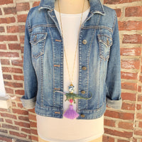 Brontosaurus pendant necklace for women. Dinosaur charm necklace on a gold chain.