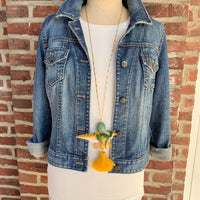 Dinosaur pendant necklace for women. Dinosaur charm necklace on a gold chain.
