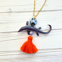 Mosasaurus pendant necklace for women. Dinosaur pendant on a gold chain.