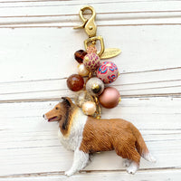 Rough collie bag charm with a mix of brown and rust colored beads and a brown and white collie figurine. Rough collie gift idea.