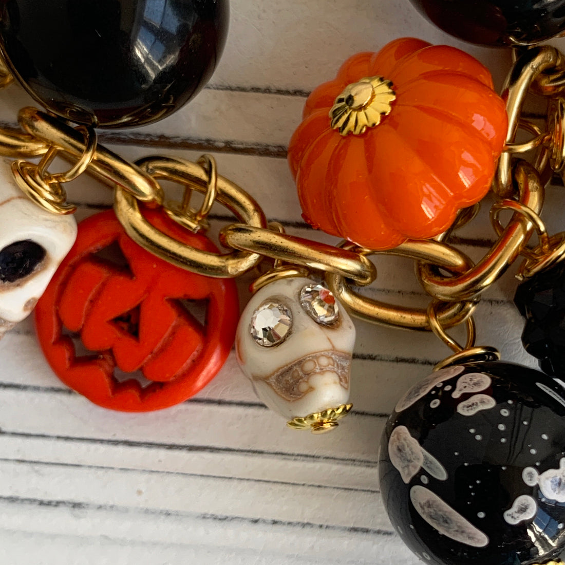 Gold plated cable chain Halloween necklace with orange pumpkins and carved jack-o&