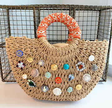 Half moon straw handbag - top handle straw handbag embellished with gold buttons, patterned buttons, seashells, rhinestones and a cameo.