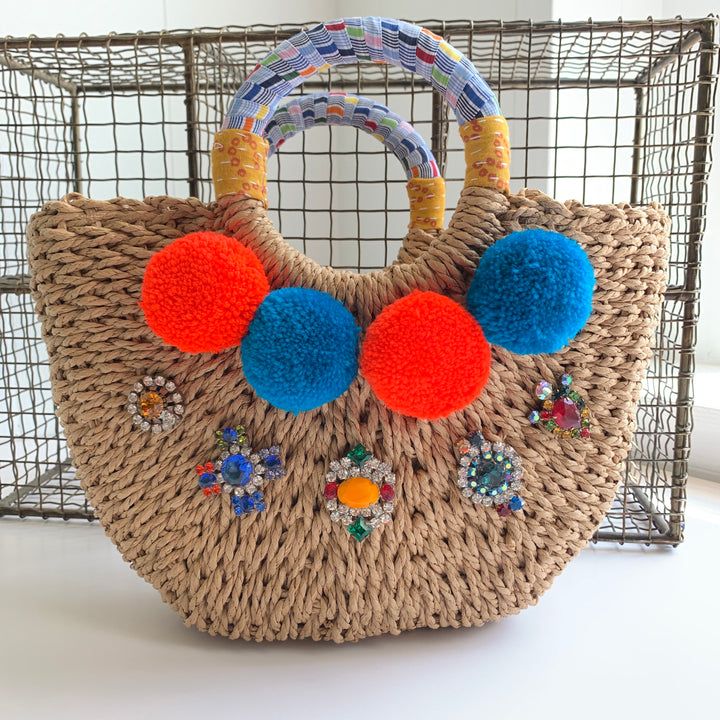 Straw Handbag for summer - cute straw handbag detailed with pom poms, rhinestones and a fabric wrapped round top handle 