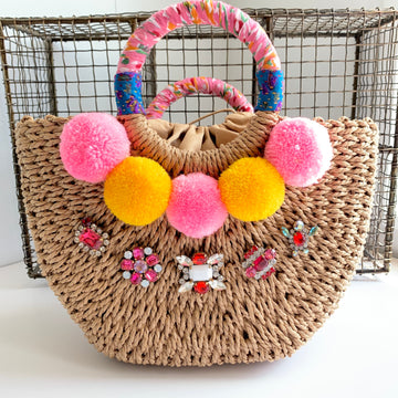 Straw Handbag, detailed with pom poms and vintage czech glass rhinestones and fabric wrapped round top handle 