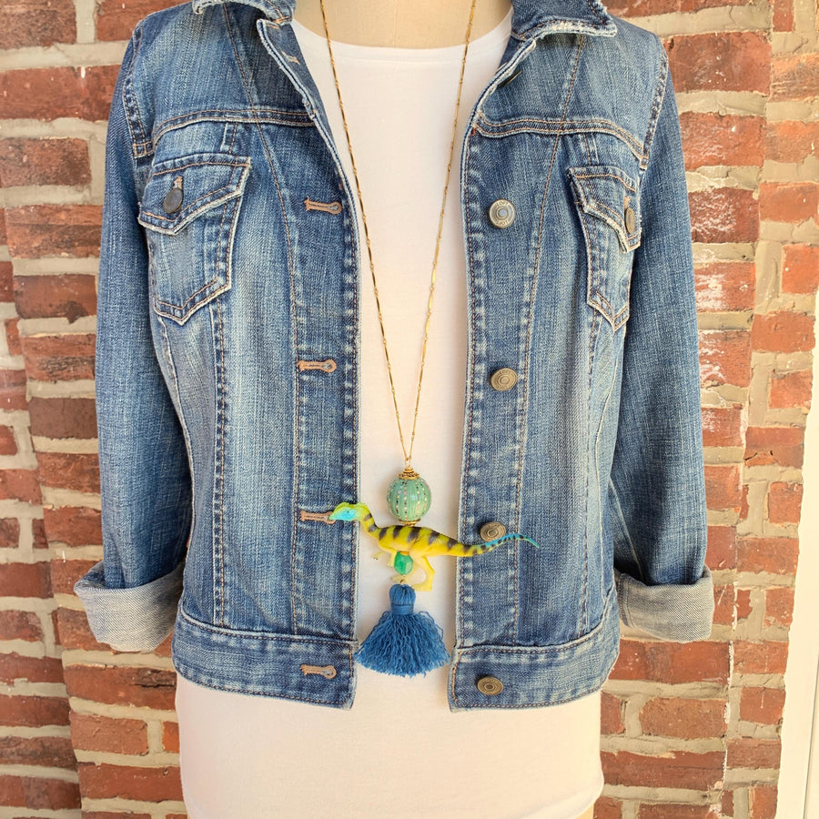 Velociraptor pendant necklace for women. Dinosaur charm necklace on a gold chain.