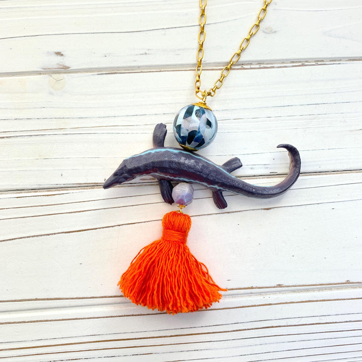 Mosasaurus pendant necklace for women. Dinosaur pendant on a gold chain.