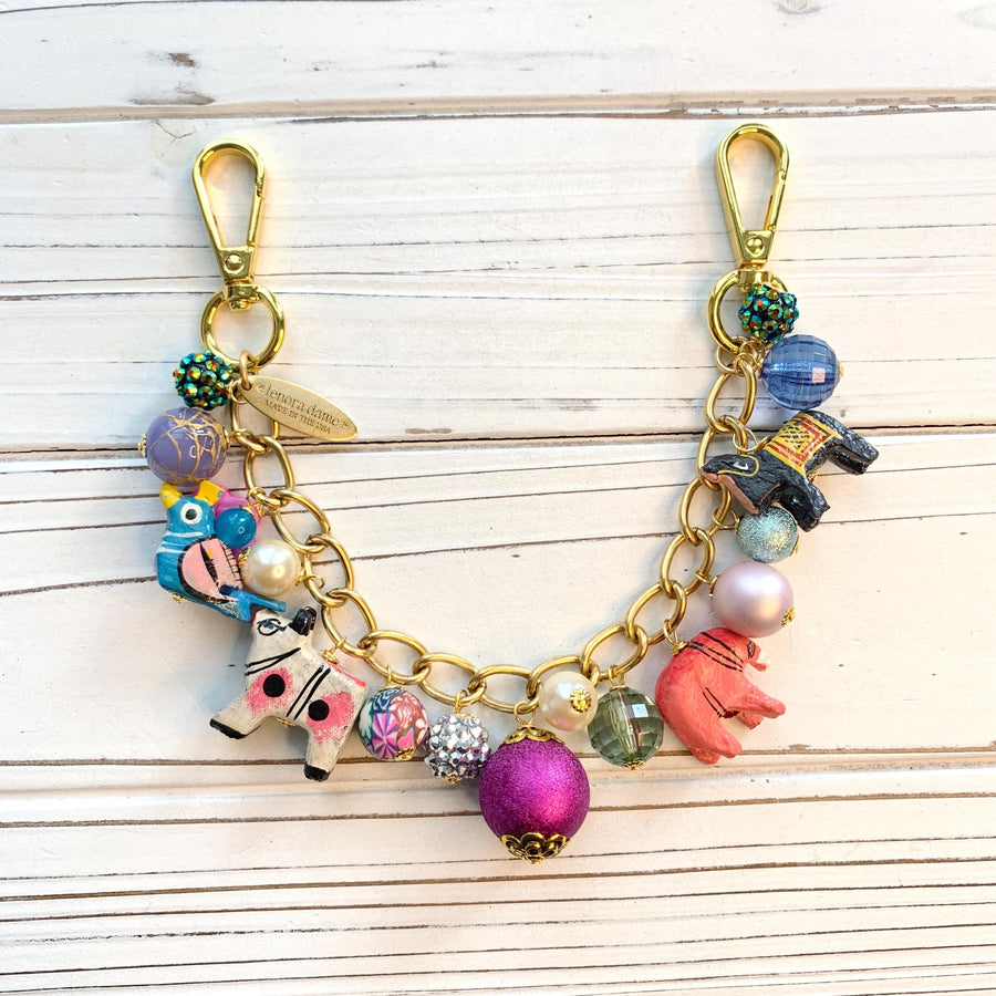 Gold bag chain with hand painted wood safari animals and a mix of colorful beads. Chain bag charm for handbags.