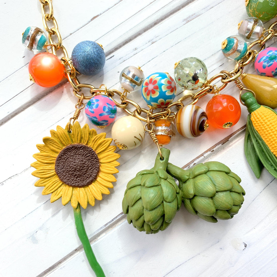 Sunflower charm. Artichoke charm.
