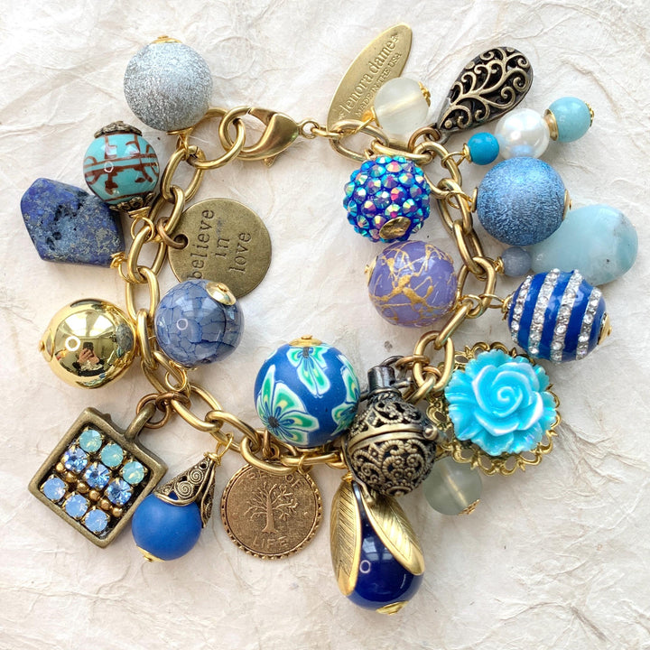 Chunky charm bracelet for women with assorted beads, metal charms, flowers, semiprecious stones, and rhinestone charms. Handmade jewelry for women. Lenora Dame bracelets.