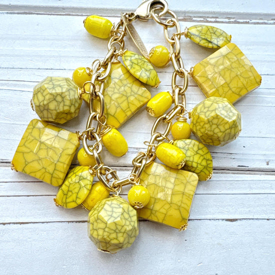 Yellow beaded bracelet for women with square, oval, and round yellow beads with a black crack design wire wrapped on a gold chain with lobster clasp and Lenora Dame Made in USA hang tag. Lenora Dame bracelet.