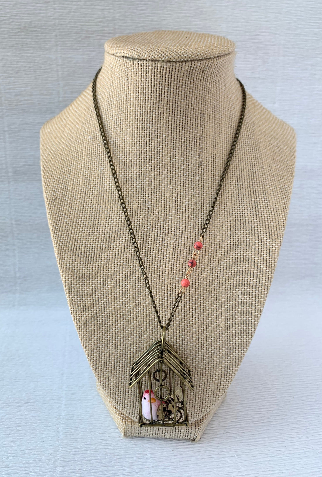 Lenora Dame A Little Bird Told Me Birdcage Pendant Necklace in Coral