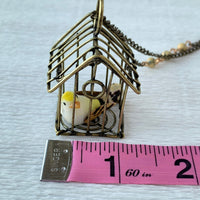 Lenora Dame A Little Bird Told Me Birdcage Pendant Necklace in Lemon
