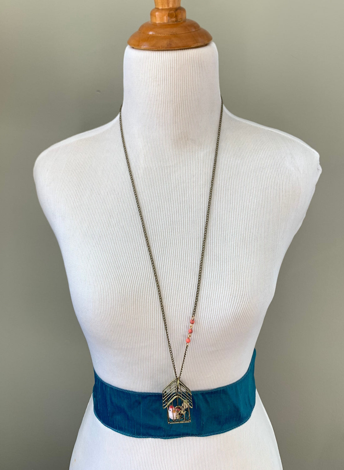 Lenora Dame A Little Bird Told Me Birdcage Pendant Necklace in Coral