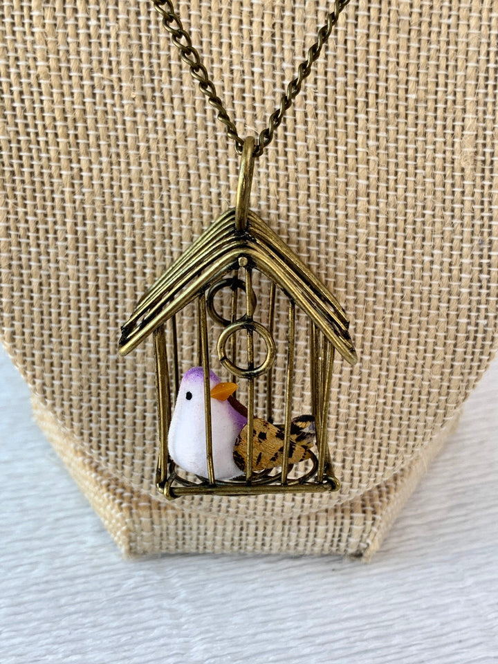 Lenora Dame A Little Bird Told Me Birdcage Pendant Necklace in Magenta