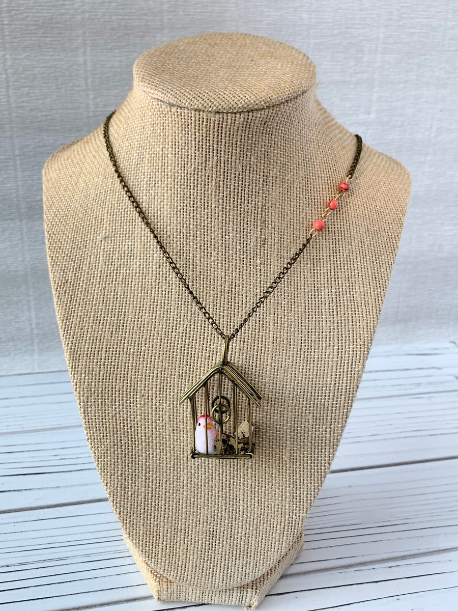 Lenora Dame A Little Bird Told Me Birdcage Pendant Necklace in Coral