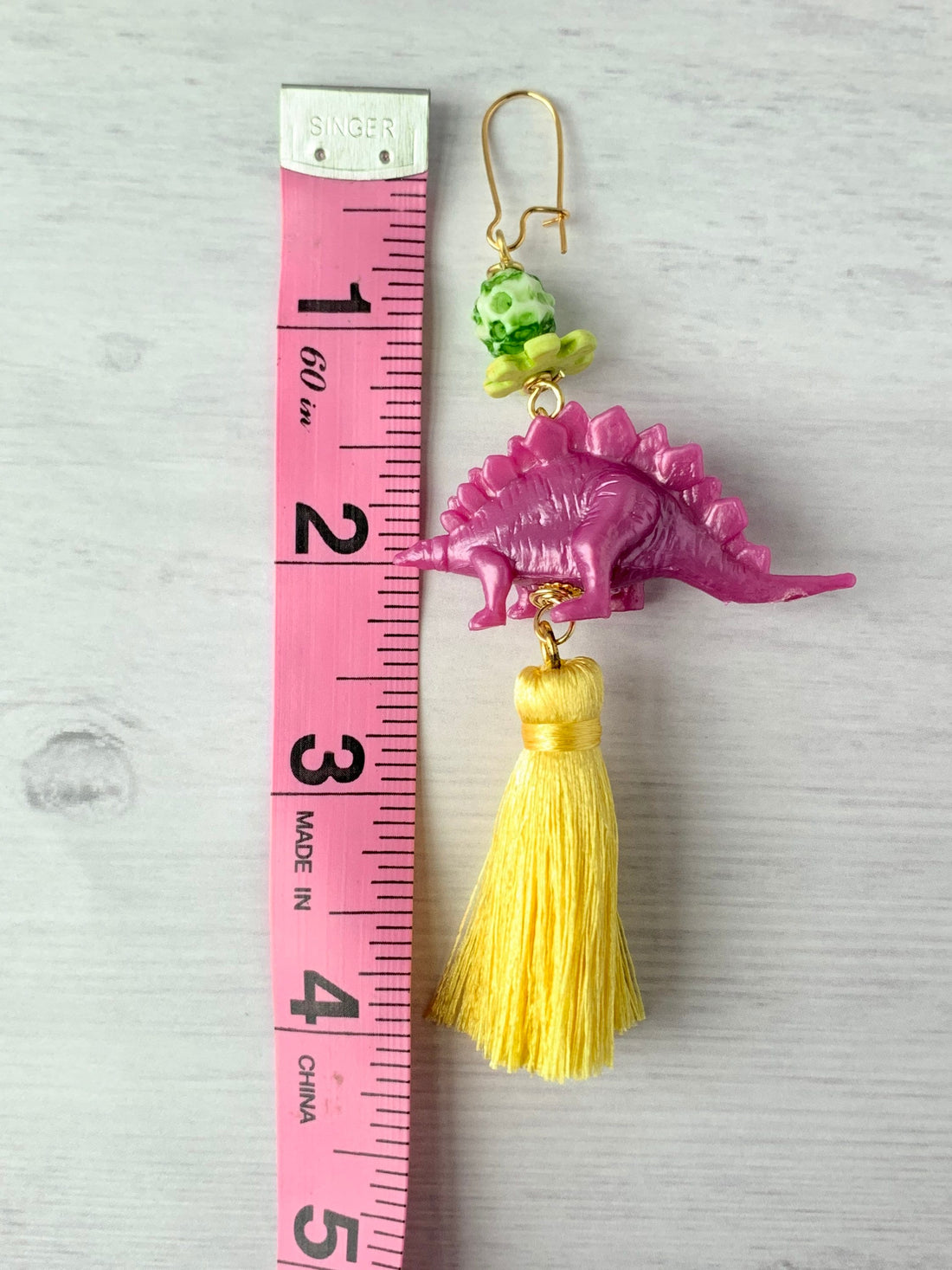 Lenora Dame Orchid Stegosaurus Tassel Earrings