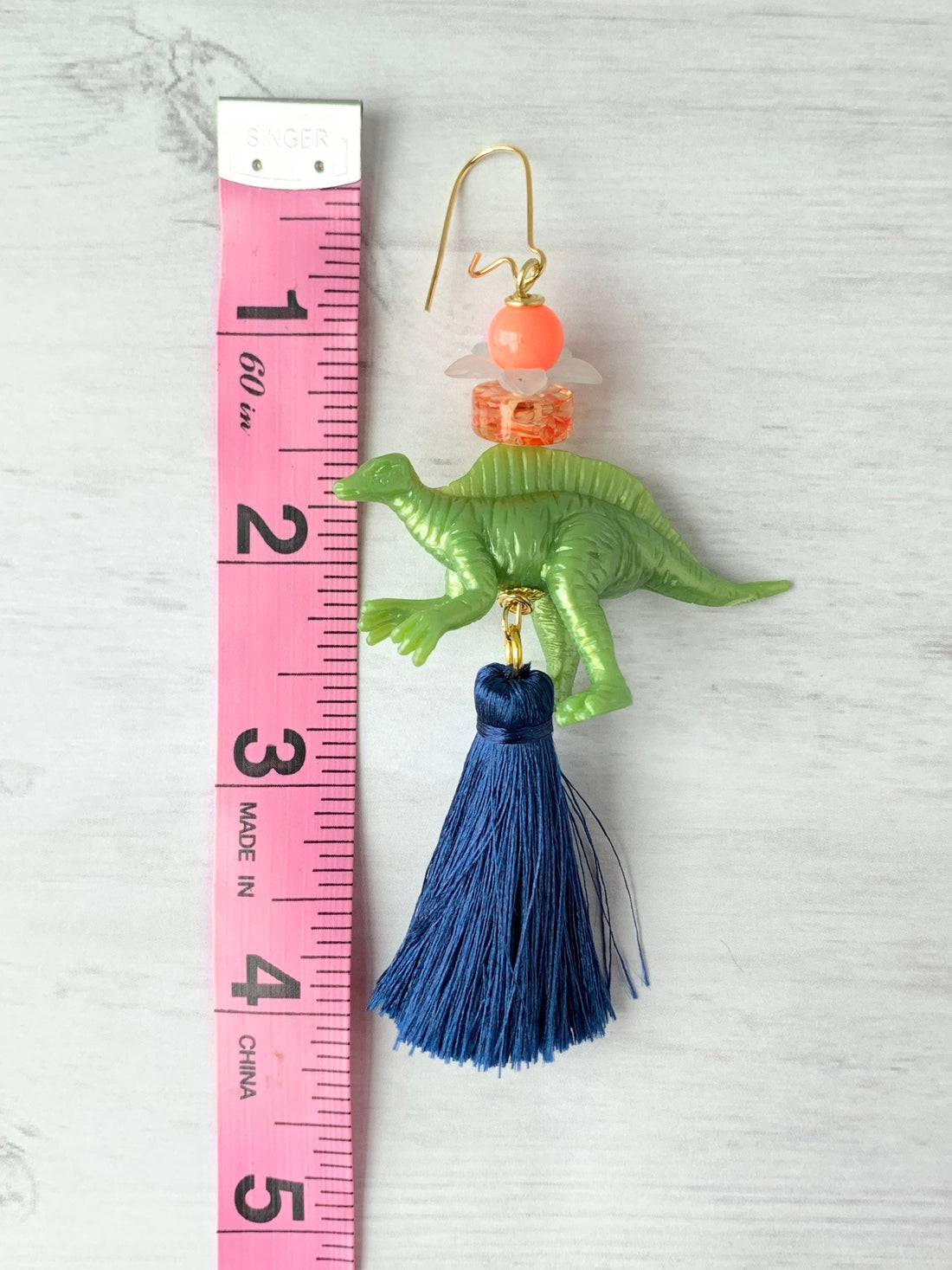 Lenora Dame Olive Spinosaurus Tassel Dinosaur Earrings