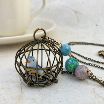 Lenora Dame Little Bird In A Vintage Cage Pendant Necklace in Cornflower