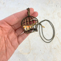 Lenora Dame Little Bird In A Vintage Birdcage Pendant Necklace in Begonia